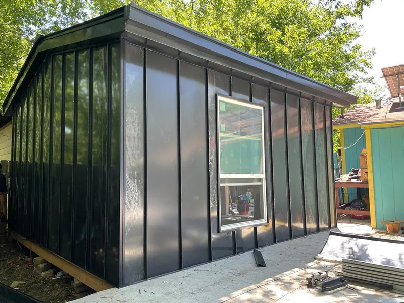 Black standing seam metal wall panels for Metal Roof Installation in East Donegal