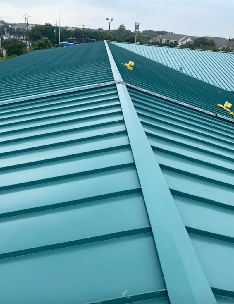 Green commercial metal roof ridge and valley for Metal Roof Repair in East Donegal
